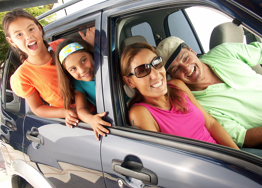 Family with kids in a car. Family tour in a car. Staying healthy while traveling with kids